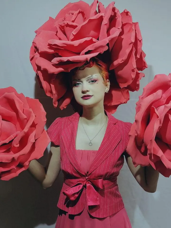 A set of headdress and roses on hands, roses on the head, a headdress from roses, a burning man, festival clothing, a suit for the show,set