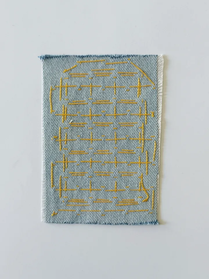 Sashiko patch hand sewn from recycled denim.