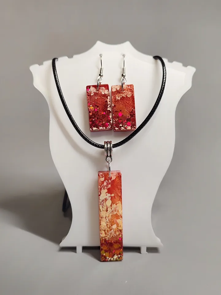 Jewelry set earrings and pendant in orange color