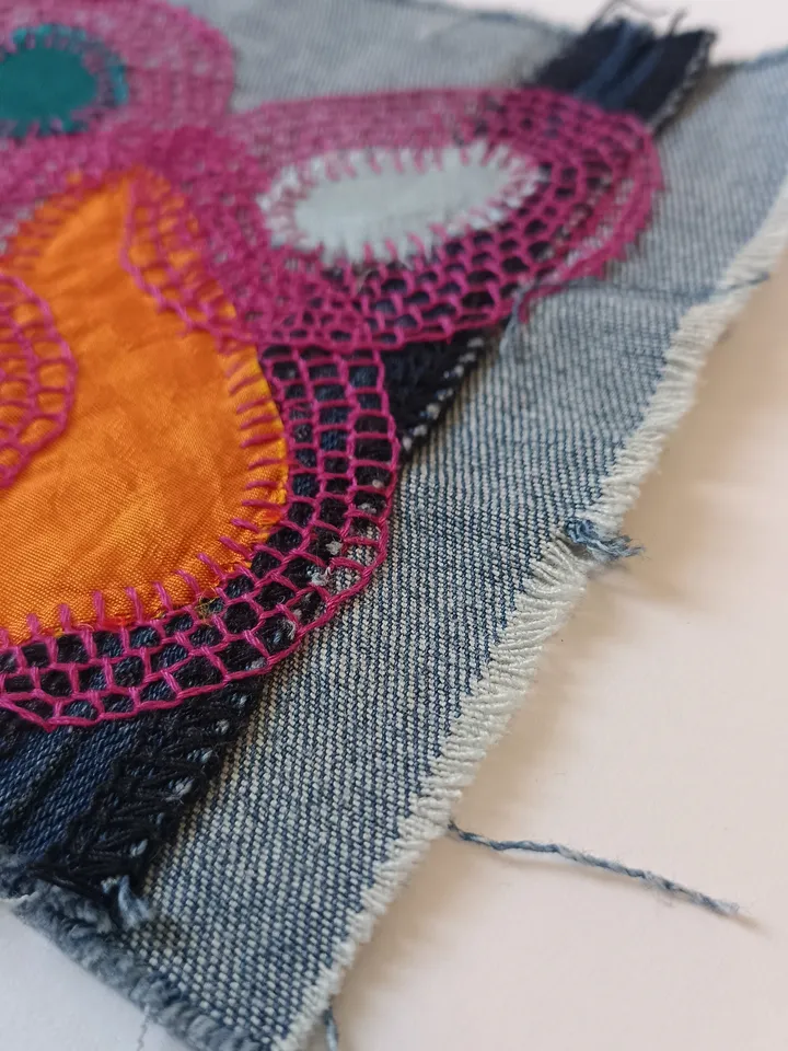 Upcycled denim boro patch. Sashiko stitching.