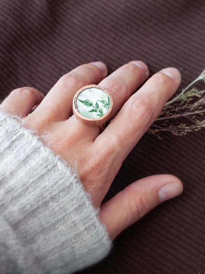 Unique handmade porcelain ring in a copper frame made using the electroforming process