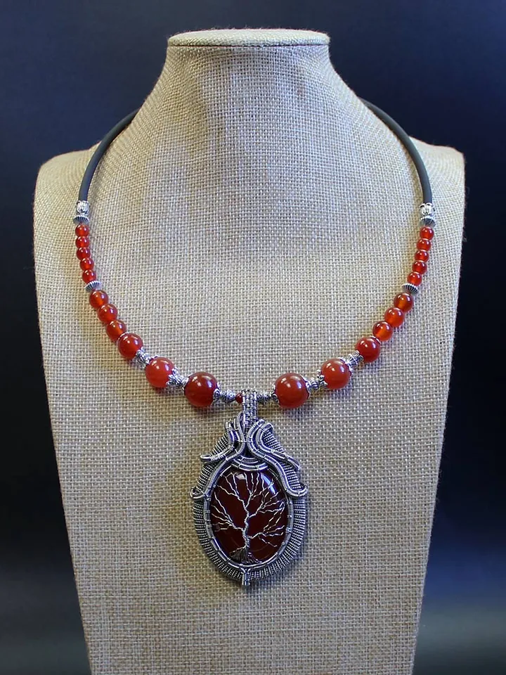 The Tree of Life necklace is handmade with natural birthstones.