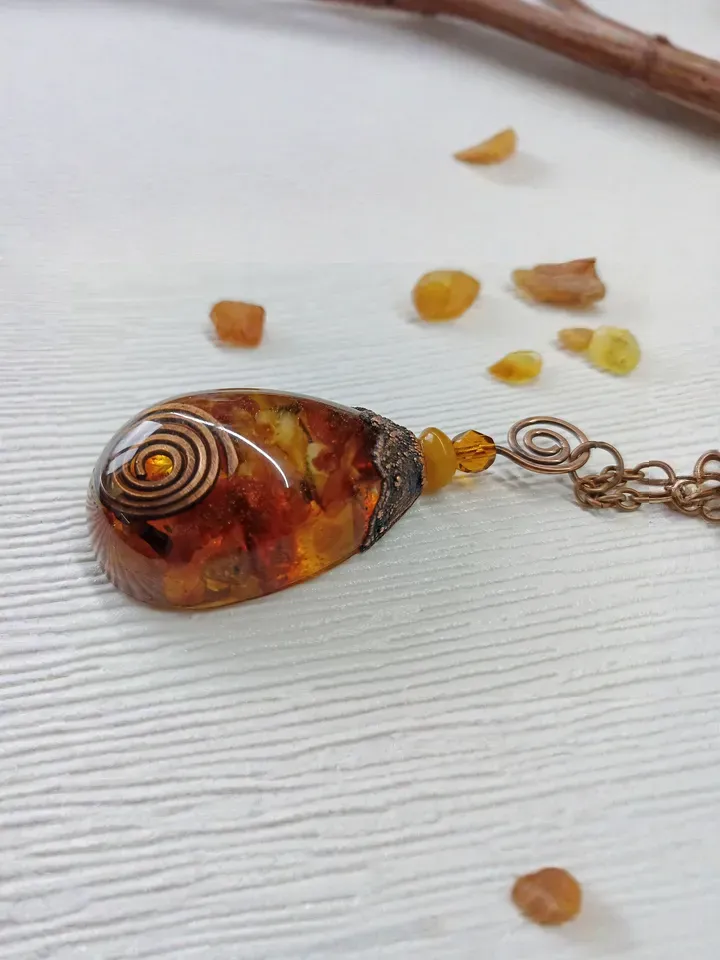 Amber Orgone pendant necklace. Raw Baltic amber chips and a copper spiral in clear eco resin powerful protection necklace generating Orgone energy