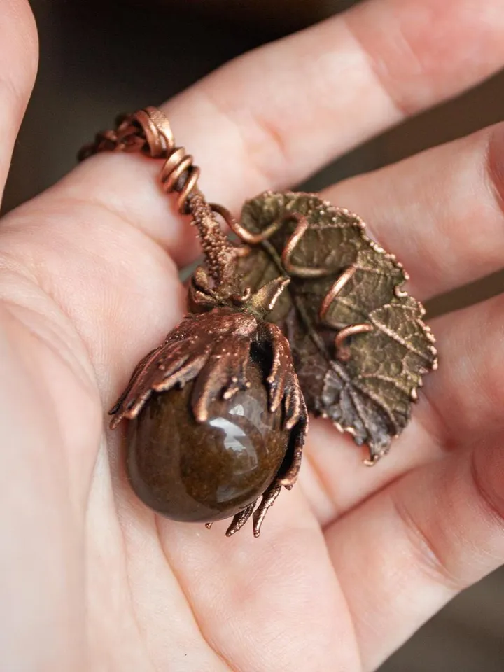 Unique handmade electroformed pendant made of natural leaves and twigs with natural tiger eye stone