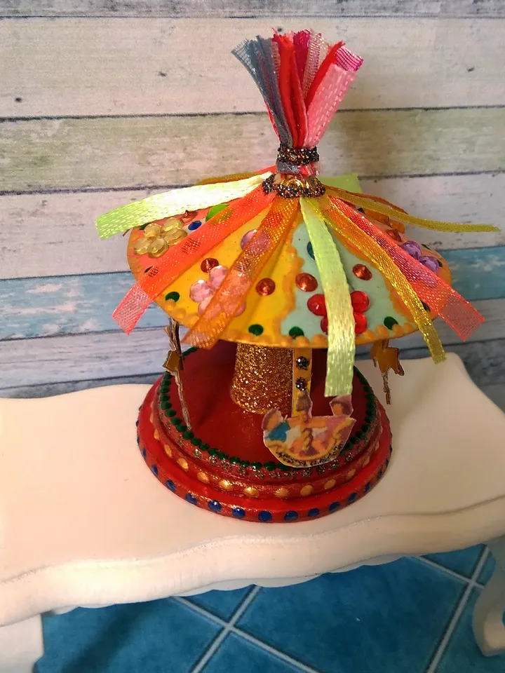 Miniature carousel. Dollhouse miniature.1:12 scale.