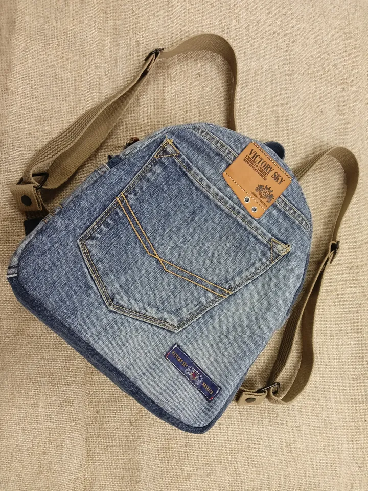 medium sized denim backpack made from recycled jeans for walking, studying, work, traveling. Backpack with 2 pockets outside and 3 pockets inside (1 with a zipper). Inside lining made of 100% cotton. Decorated with a label and a leather strip on the zippe