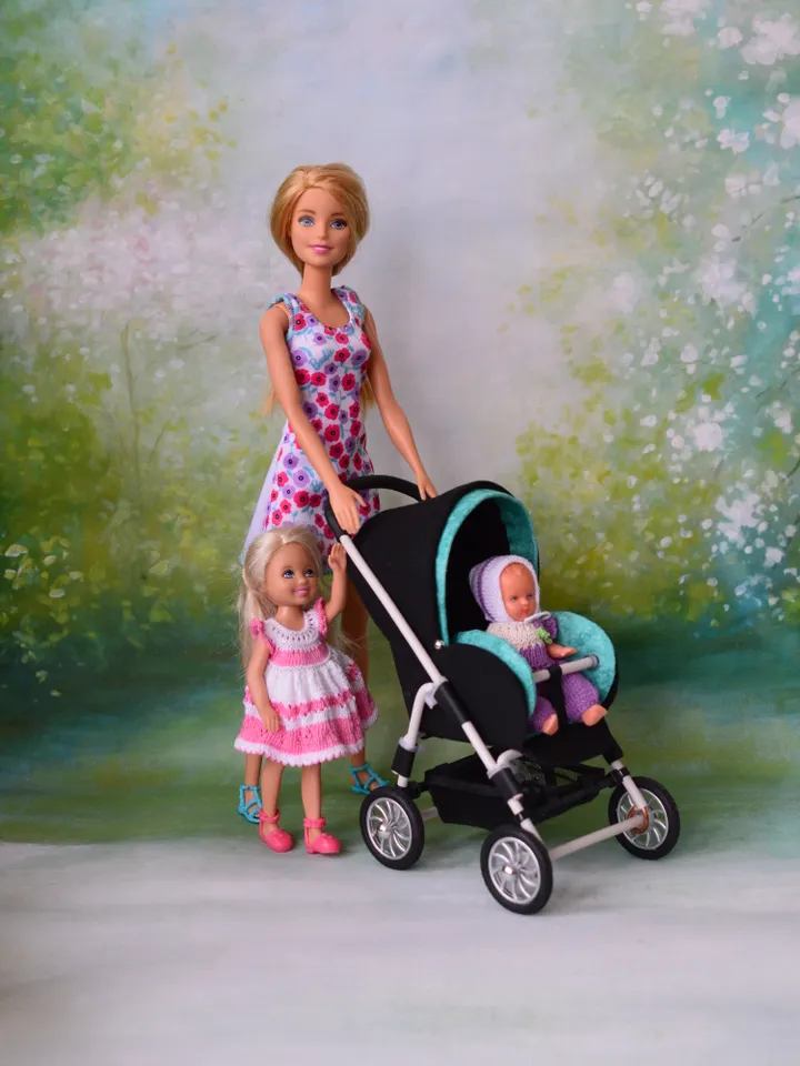 Miniature toy stroller for dolls in 1/6 scale. Accessories for small dolls and poupins. Pram for Barbie doll.