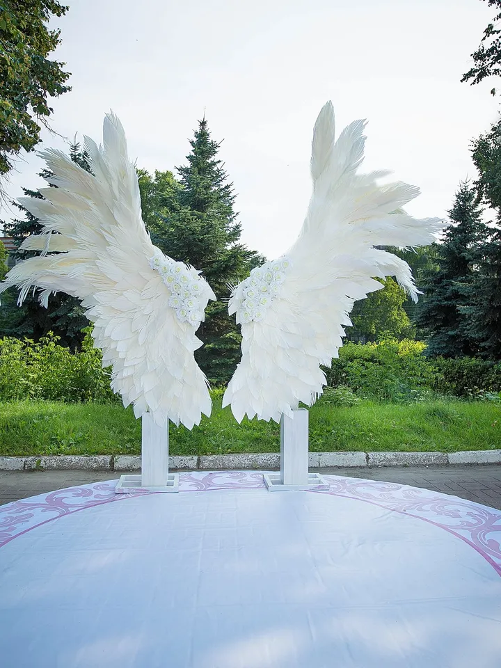 Giant angel wings wedding backdrop on metal stand, luxury street party decoration