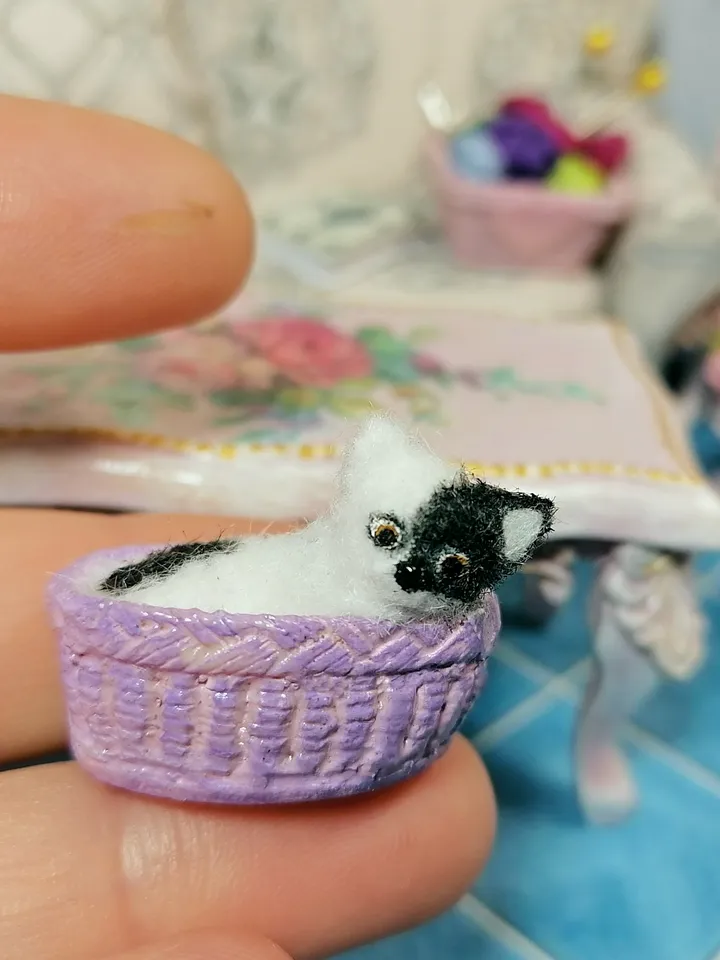 Cat in a basket. Dollhouse miniature.