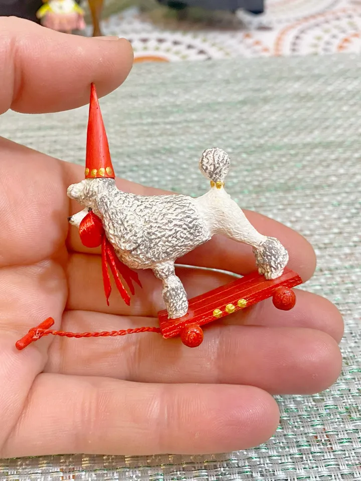 Poodle on a cart. Doll toy. Scale 1:12.