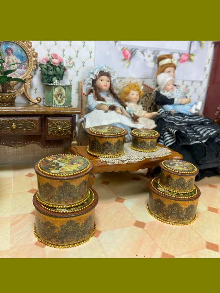 A set of handmade miniature boxes for filling the interior of a dollhouse in 1:12 scale.