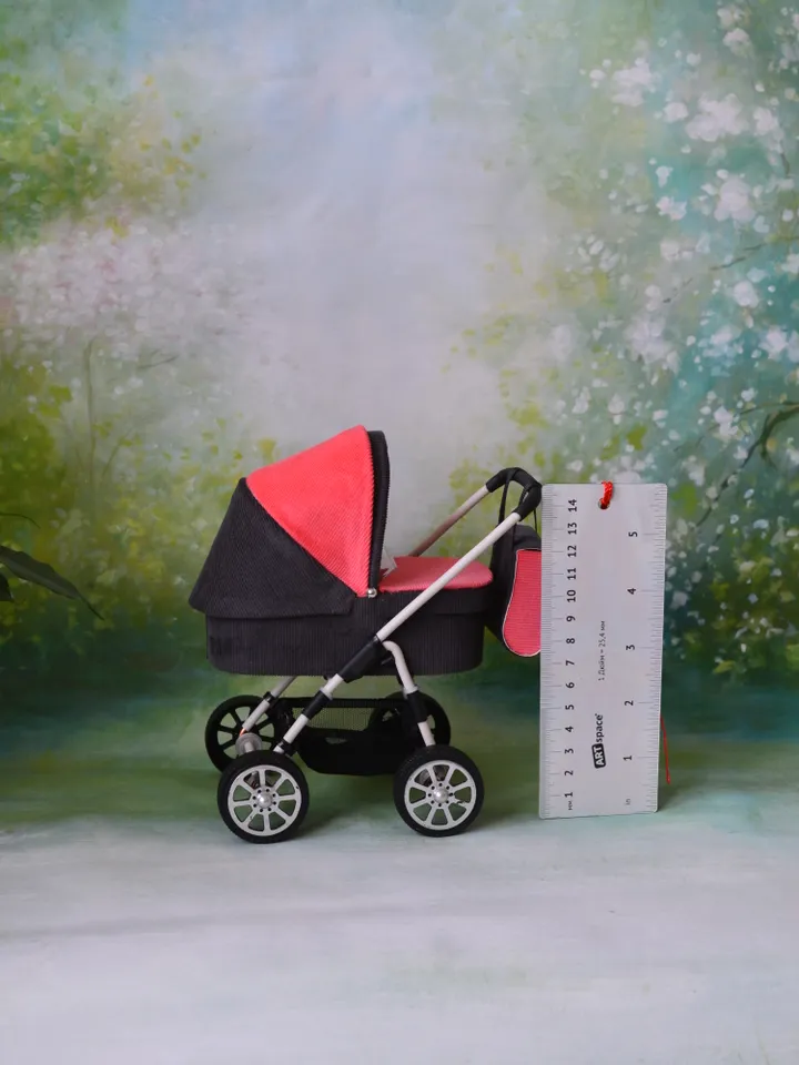 Miniature toy stroller for Barbie dolls.
