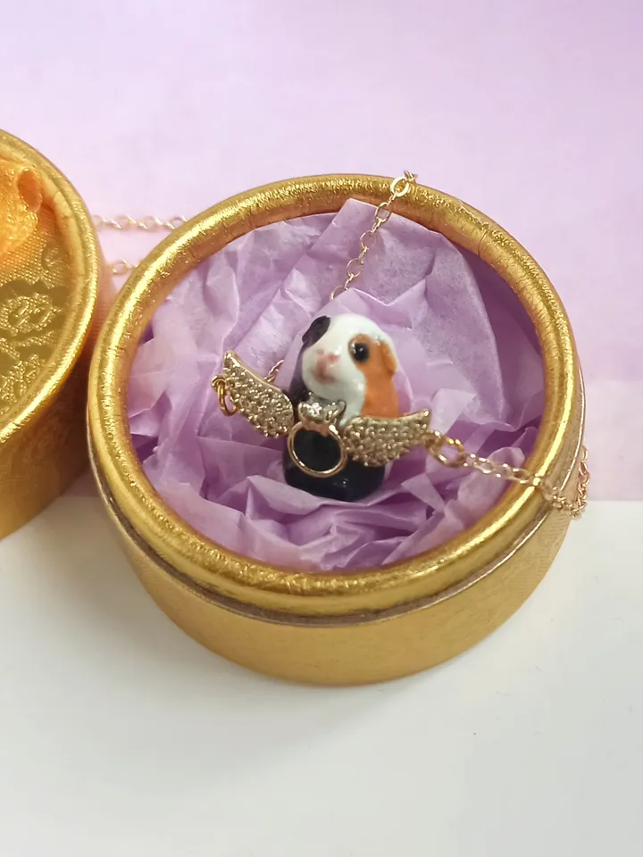 Handmade guinea pig pendant, adorned with rhinestones and gold wings (US discount)