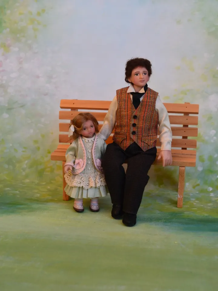 Miniature girl doll for Victorian dollhouse in 1/12 scale.