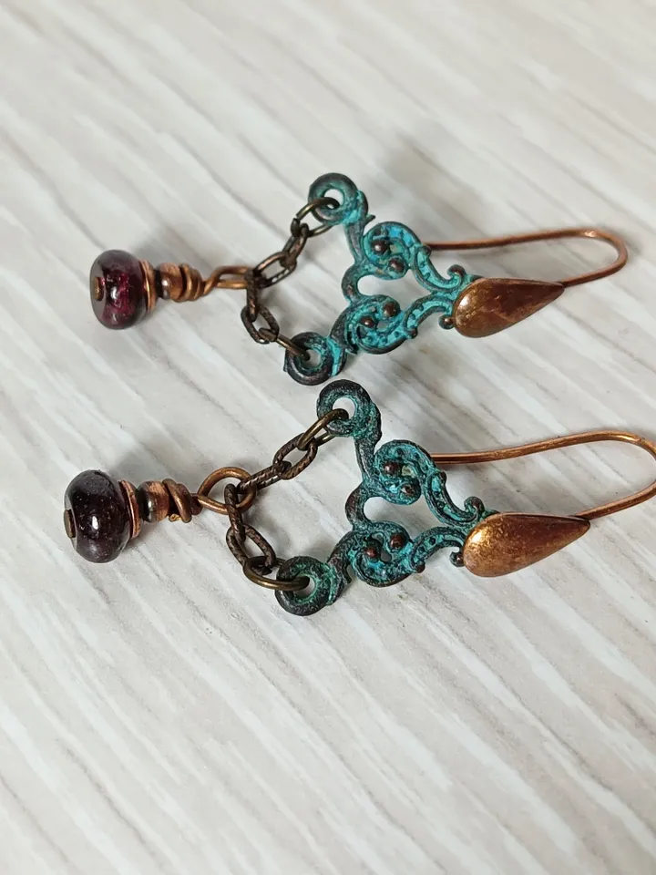 Boho Shabby chic Vintage style solid and natural copper earrings Textured patinated with a garnet bead and chain