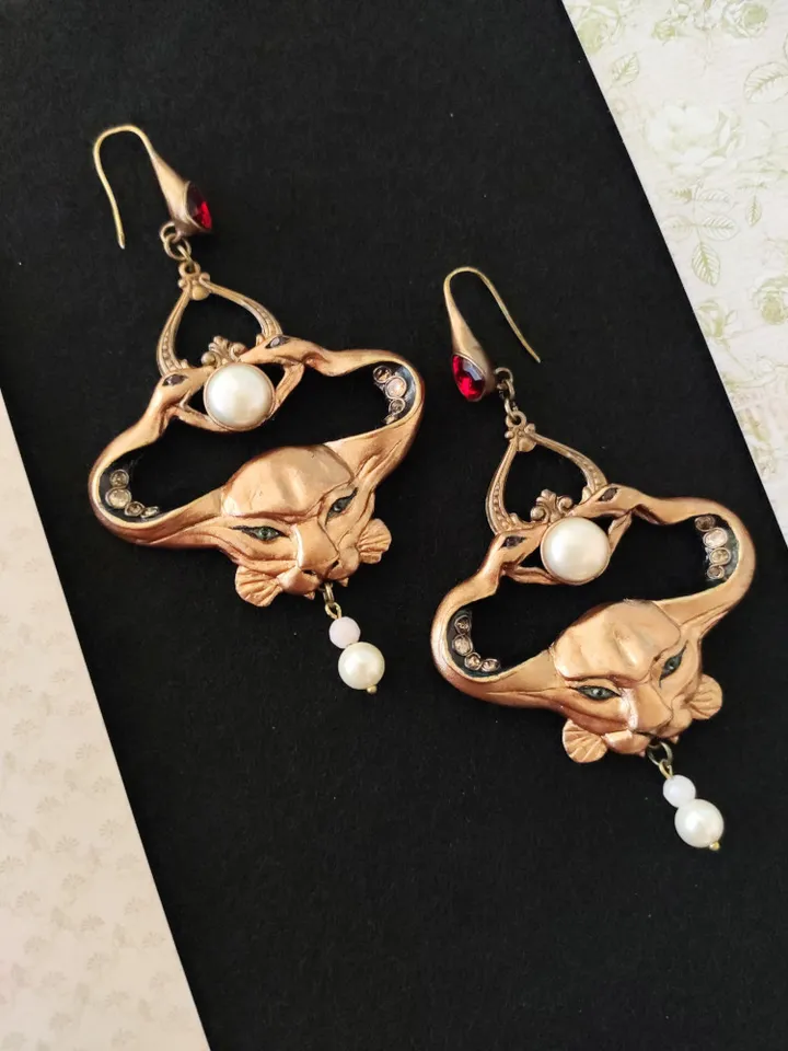 Custom Art Nouveau Symbolist earrings crowned with two snakes