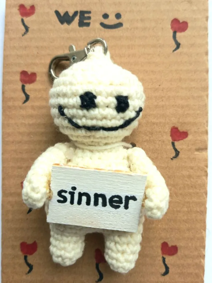 The keychain "sinner" for a bag or keys, a toy in the car interior, a pendant for the rearview mirror