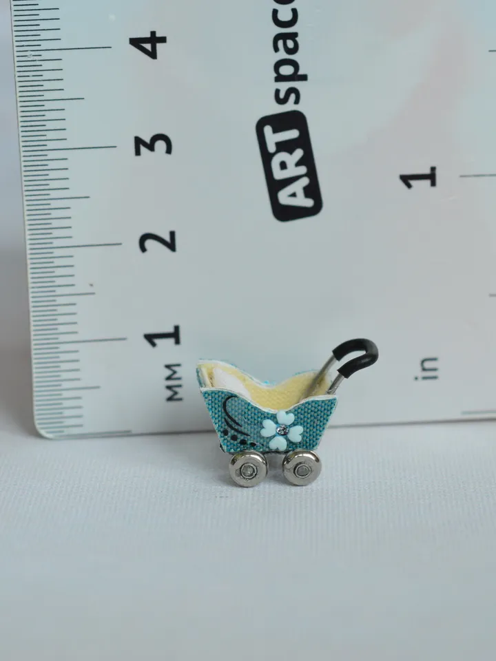 Miniature doll stroller. 1:48 scale. Dollhouse toy. Baby stroller.