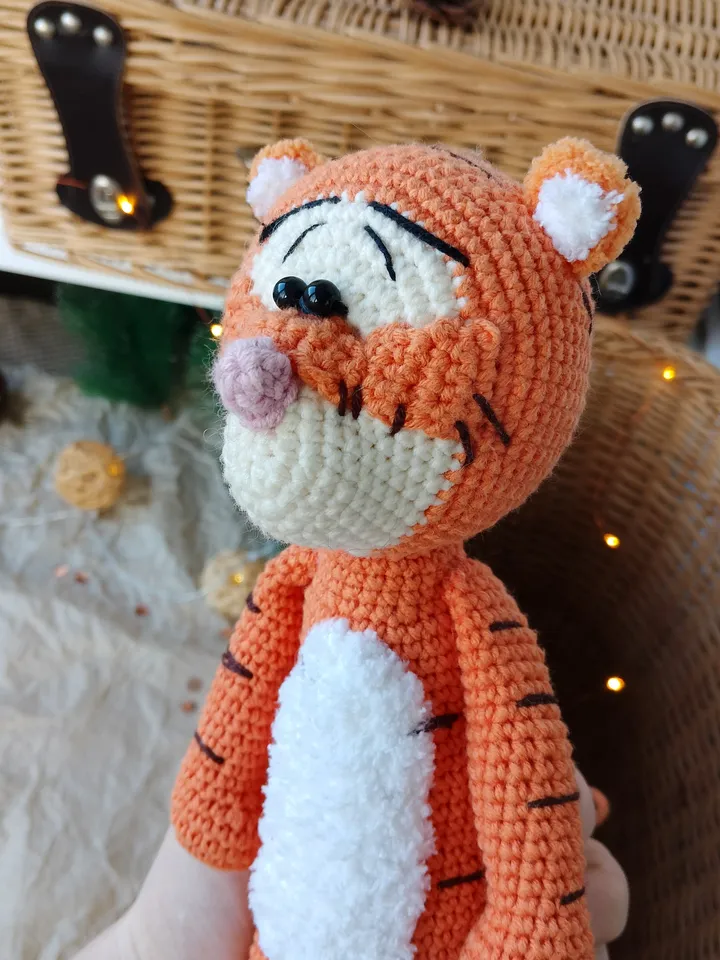 Orange tiger cub Disney cartoon character. Stuffed animal tiger soft toy