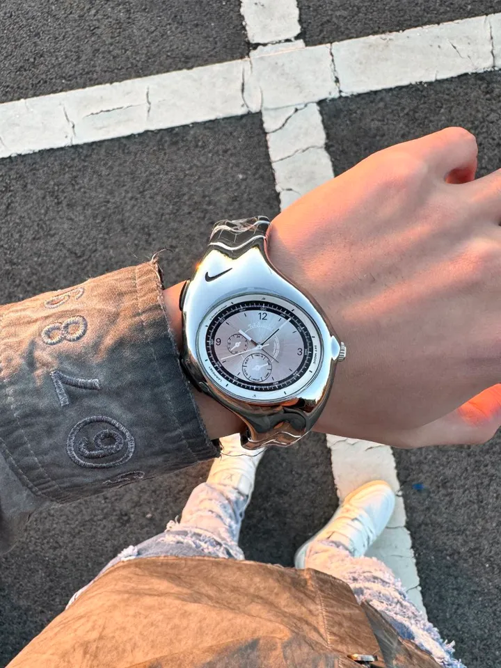 Nike Triax wristwatch: glossy silver case and dial
