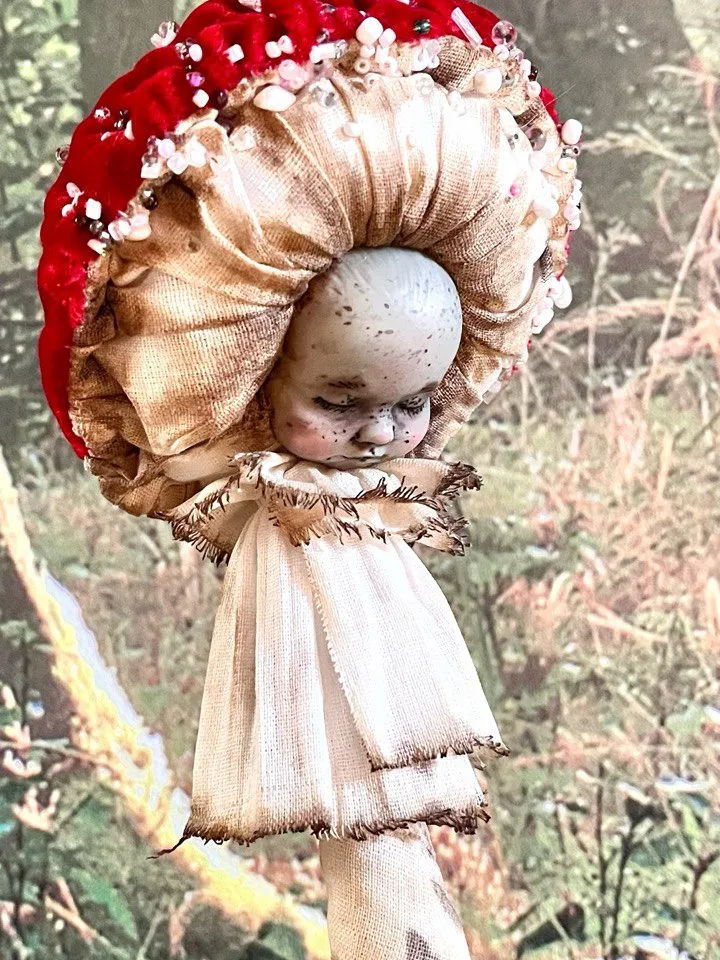 Art doll Mushroom. Unusual handmade statuette. Sleeping child-toy in the image of a fly mushroom. Mushroom is a textile sculpture. Unique statuette made of fabric and polymer clay, decorated with beads and beads. An art object for your interior and collec