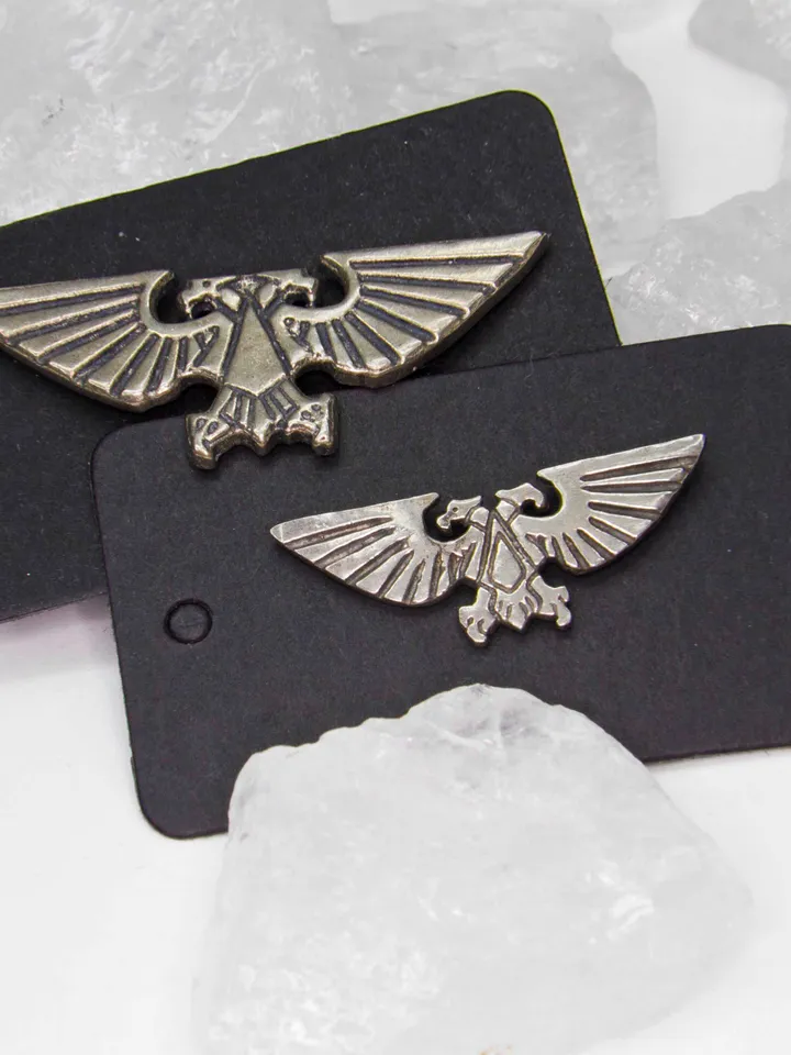 A pair of Large and Medium Imperial Aquila badges (German Silver CuNiZn)