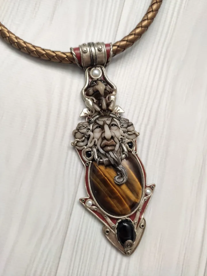 Necklace Shaman on a leather cord. Central cabochon natural tiger eye stone.