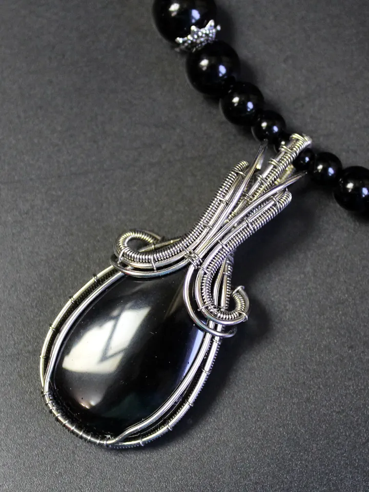 Handmade necklace made of natural stones. Wire wrapped stone pendant.