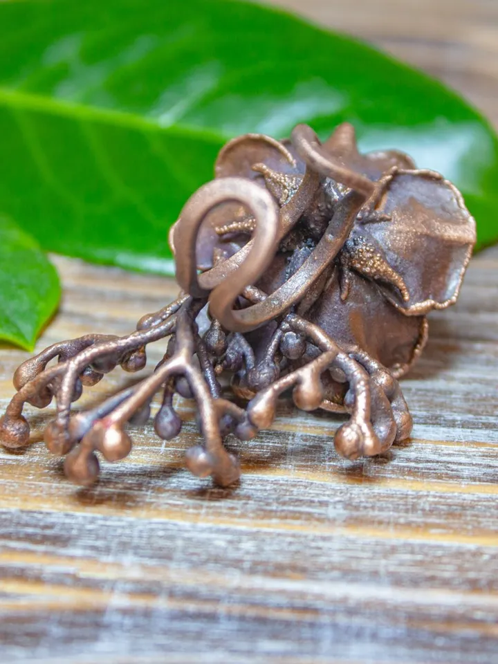 Unique handmade copper ring made from a real flower bud using the electroforming method, decorated with a Swarovski crystal