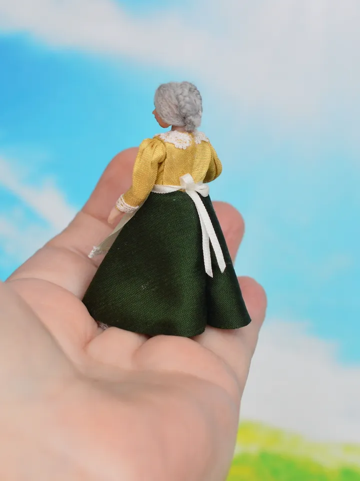 Miniature dolls in 24th scale. A grandmother with a baby for a dollhouse.