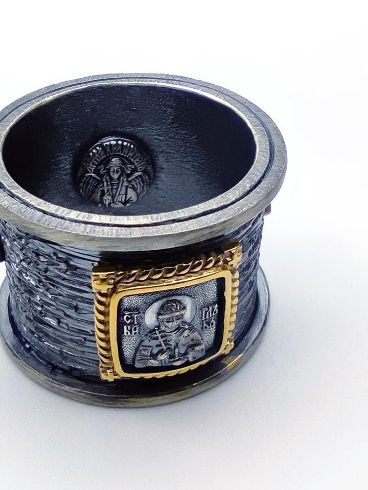 Gorgeous ring with faces of saints