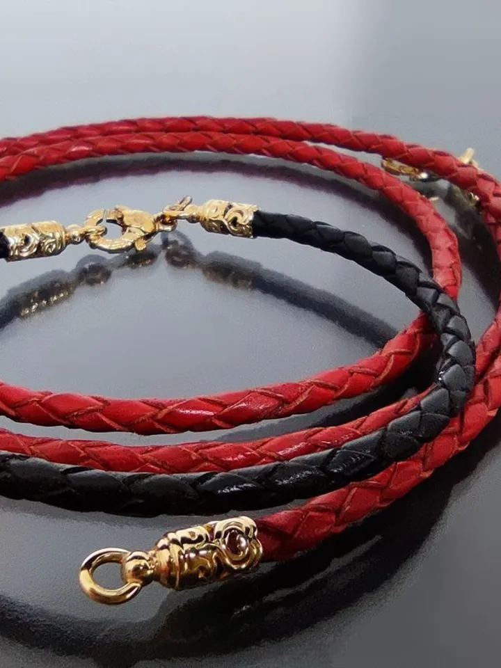Leather braided bracelet with a chess bead. Silver, gold plated, hot enamel.