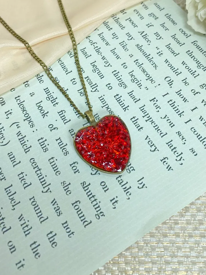 Pendant on a cord. Red heart. Handmade jewelry.3D effect.