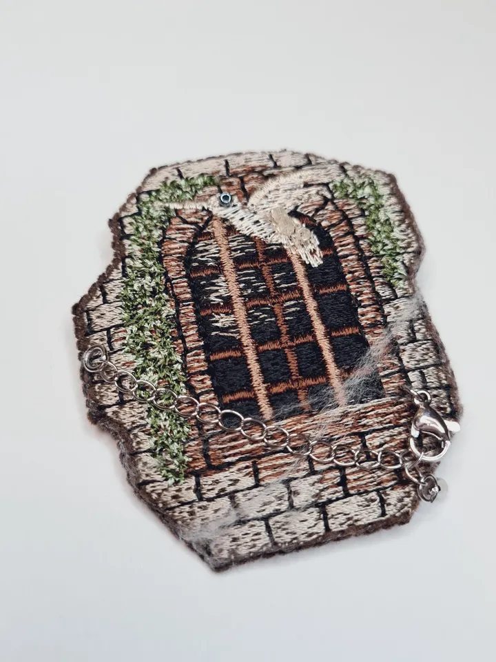 Machine embroidery design for art therapy: Brooch " Window of the old castle"