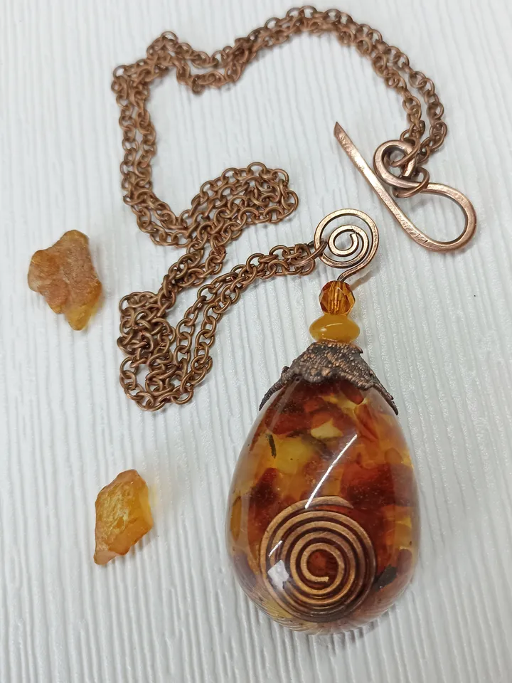 Amber Orgone pendant necklace. Raw Baltic amber chips and a copper spiral in clear eco resin powerful protection necklace generating Orgone energy