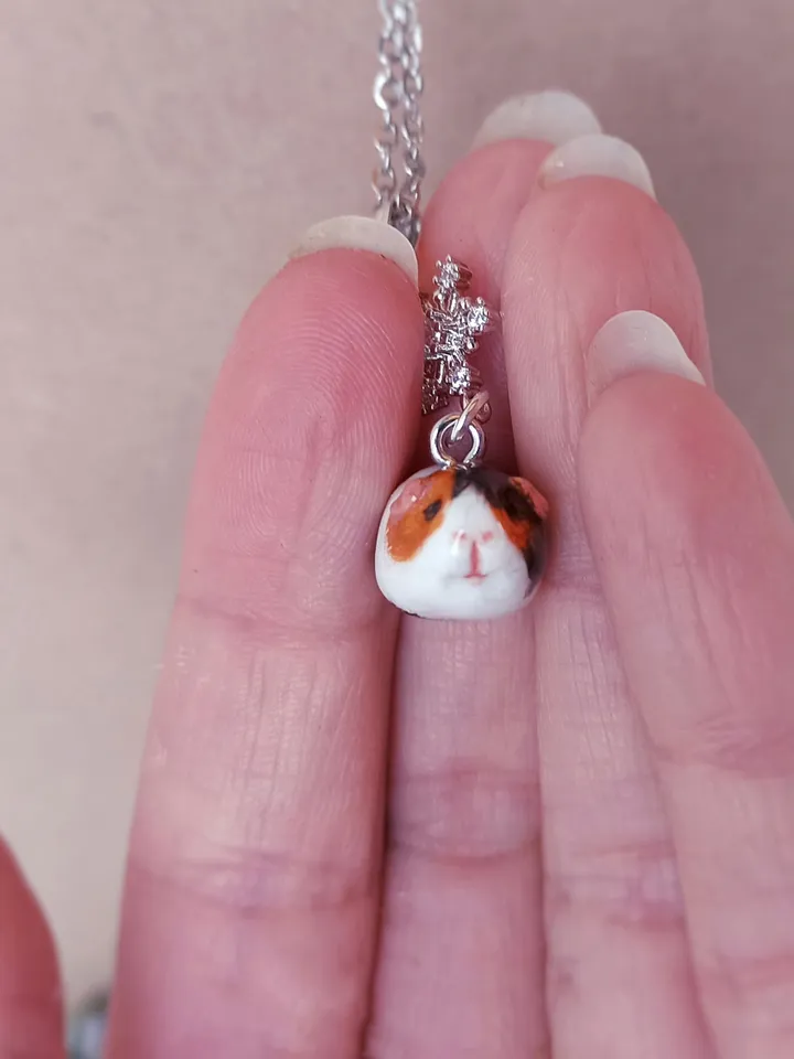 a Handmade guinea pig necklace rundom color  (pre-order)