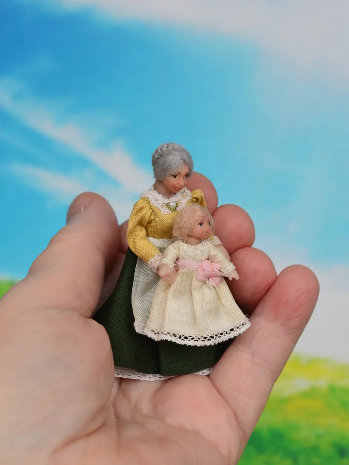 Miniature dolls in 24th scale. A grandmother with a baby for a dollhouse.