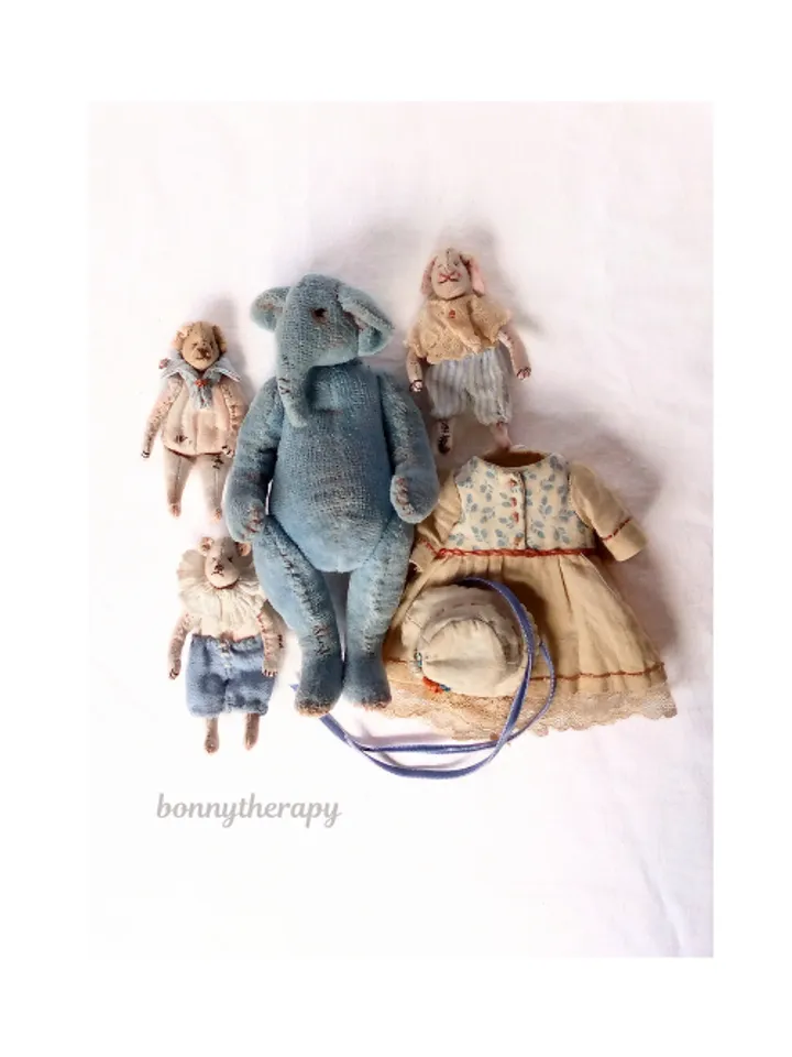 Textile elephant toy with a little friends