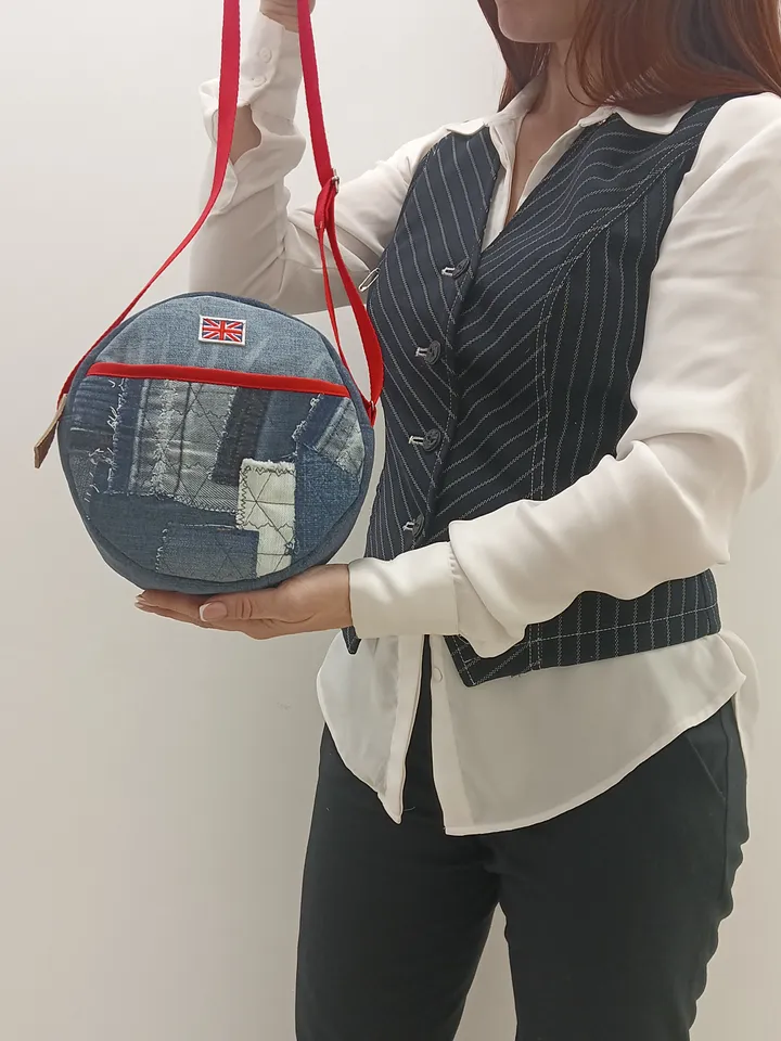 Cute handmade denim round crossbody bag with Red belt, brown polka dot cotton inside, pockets inside and outside, leather zipper stripe, weight only 160 grams, very light. A handbag for walks, excursions, and travel.