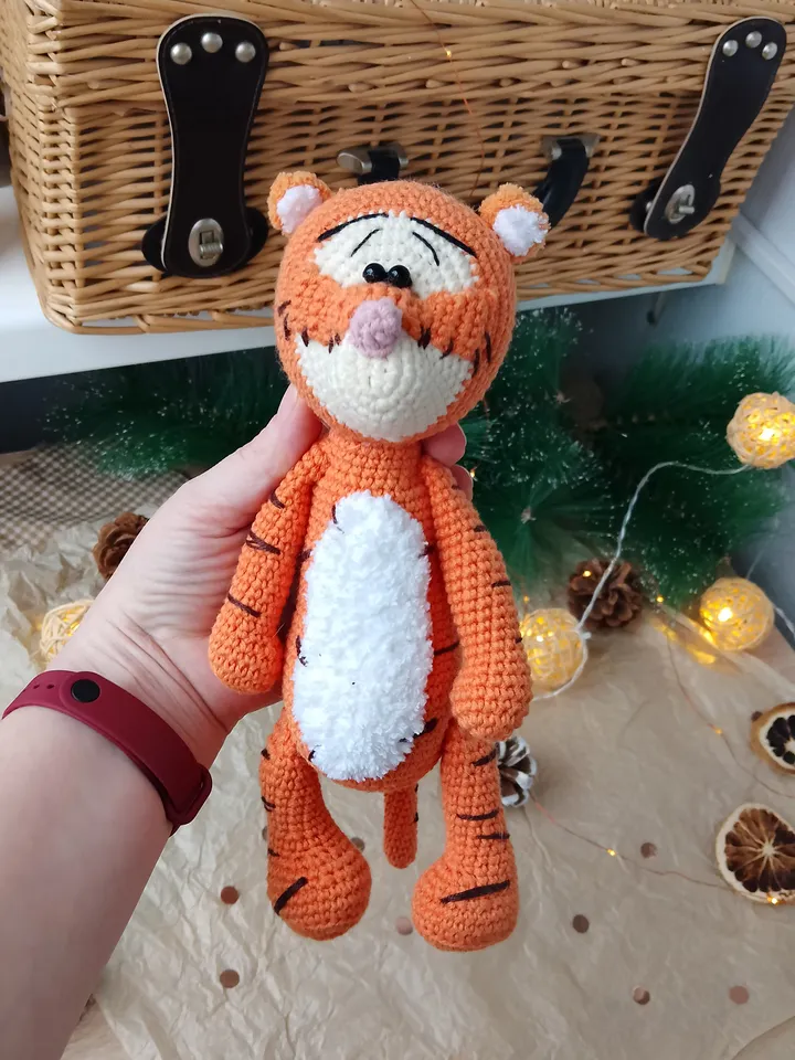 Orange tiger cub Disney cartoon character. Stuffed animal tiger soft toy