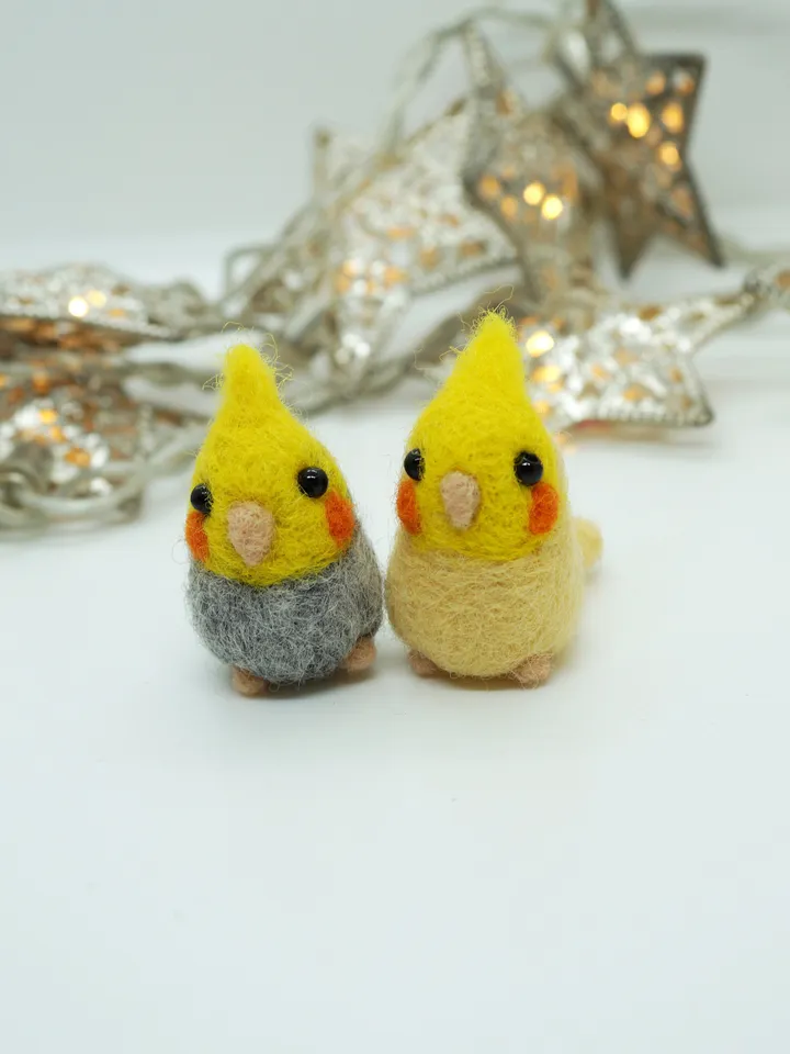 A pair of needle felted miniature cockatiels, made to order.