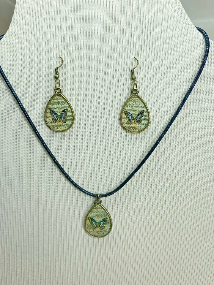 Handmade jewelry set. Shiny butterflies in a bronze frame. designer jewelry.