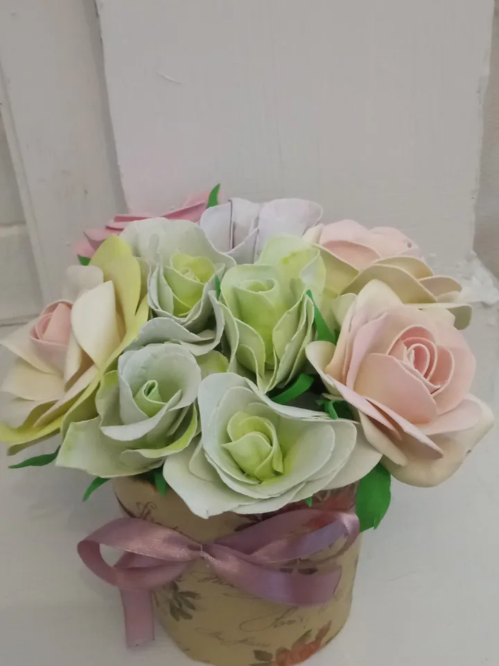 Beautiful composition of roses and eustomes in delicate colors. Handmade