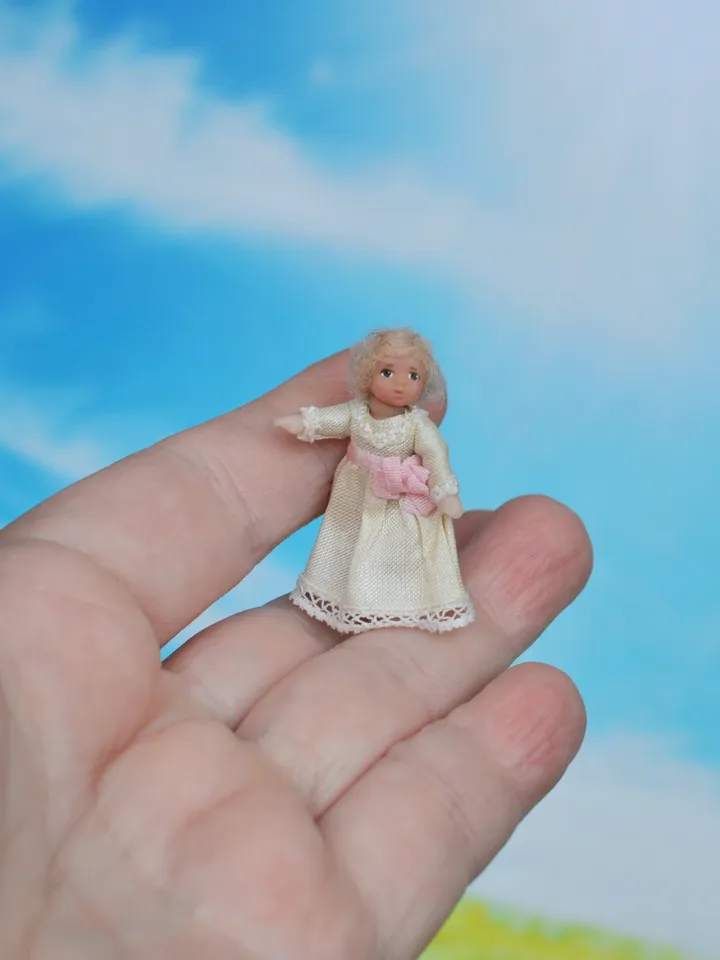 Miniature dolls in 24th scale. A grandmother with a baby for a dollhouse.