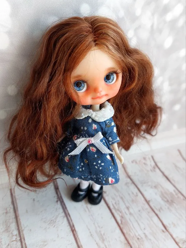 Charming little girl with brown hair and blue eyes. Author's miniature doll for your collection.