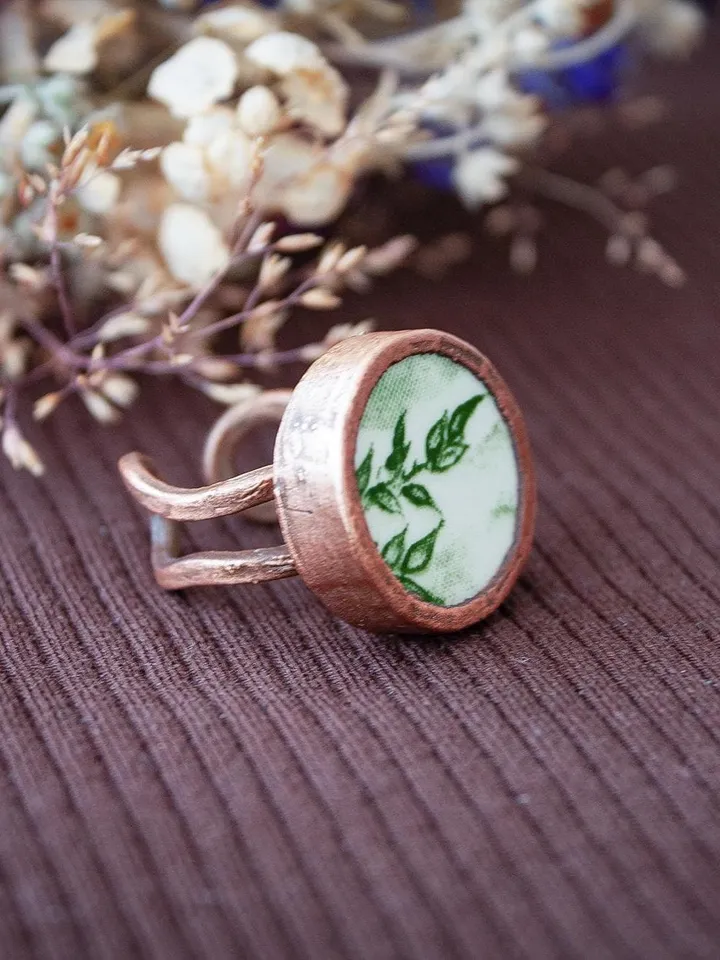 Unique handmade porcelain ring in a copper frame made using the electroforming process
