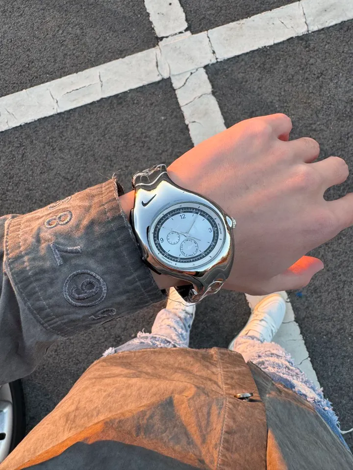 Nike Triax wristwatch: glossy silver case and dial