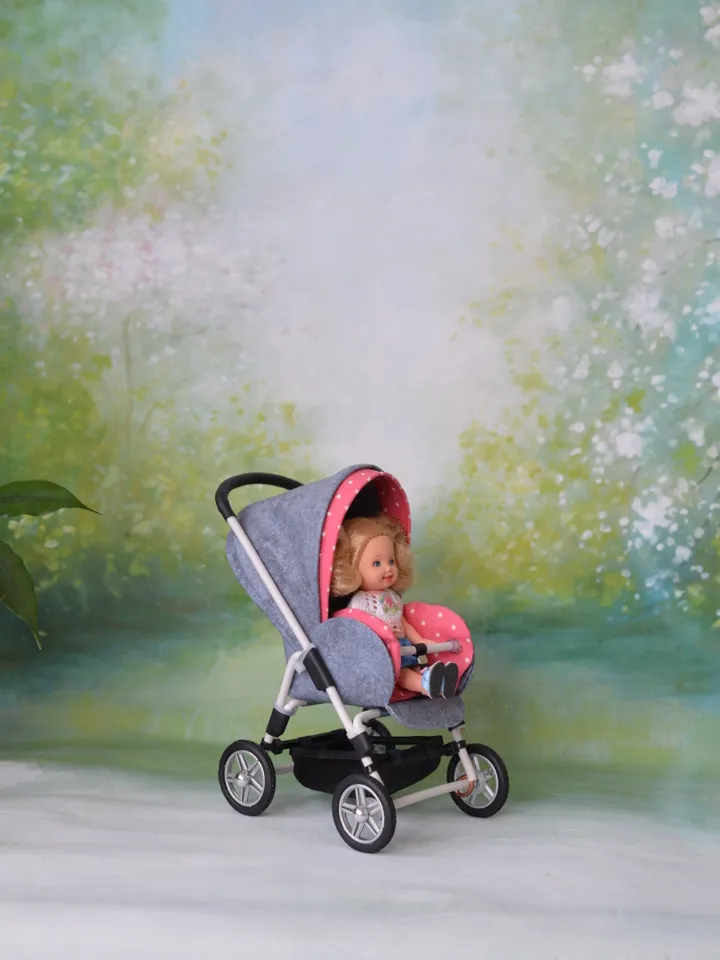Miniature toy stroller for dolls in 1/6 scale. Accessories for small dolls and poupins. Pram for Barbie doll.
