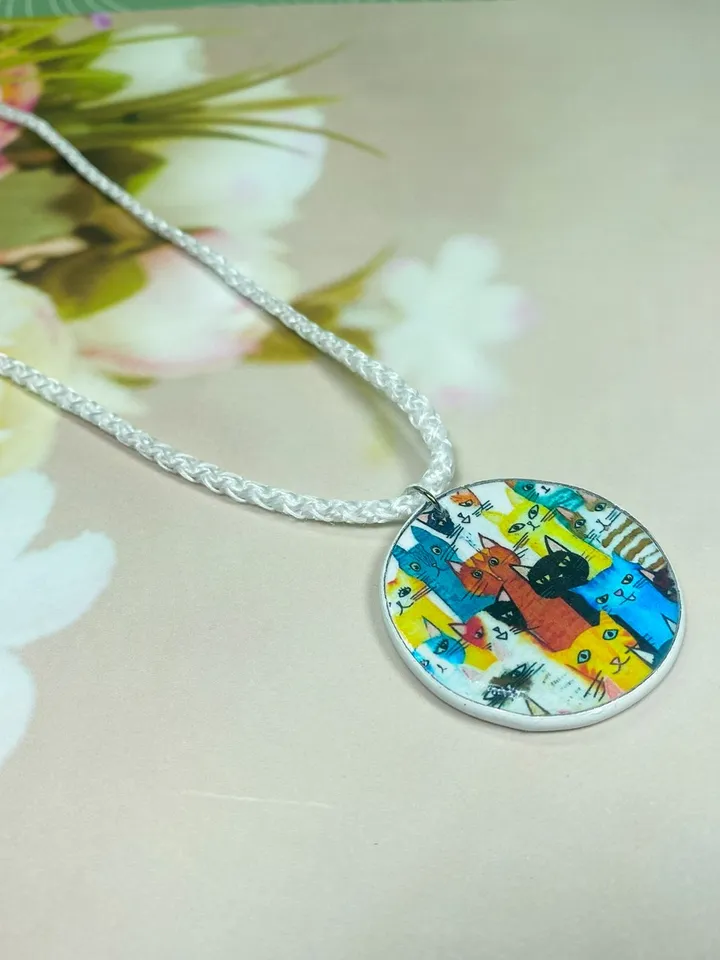 Pendant with kittens. Necklace. Handmade jewelry.Pendant on a cord. Author's design.