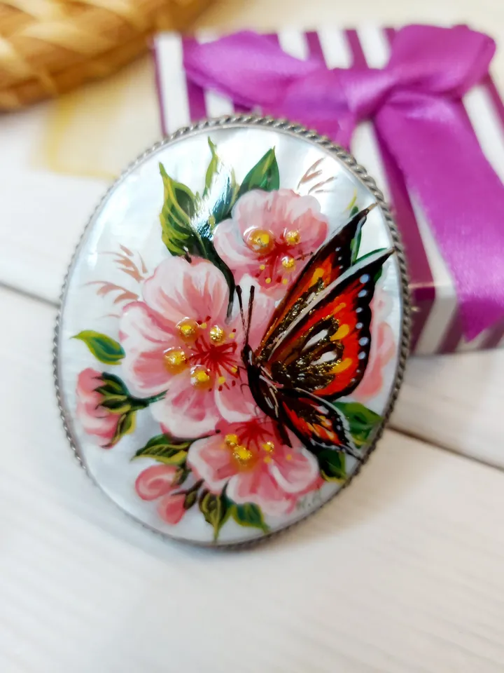 Brooches for women: A delicate butterfly on wild rose blossoms mother of pearl pin, hand painted pink floral brooch made from shell